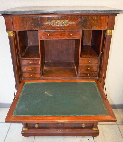 null Mahogany empire secretary opening by 2 leaves and 4 drawers, topped by a gray...