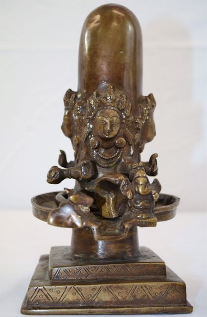 null 
Indian bronze of Shiva Ligam surrounded by four deities holding offerings,...