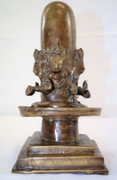 null 
Indian bronze of Shiva Ligam surrounded by four deities holding offerings,...