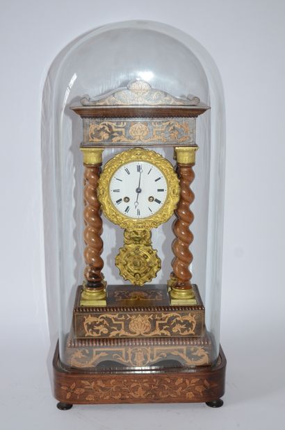 PENDULE Charles X clock in marquetry and twisted columns, with base and presented...