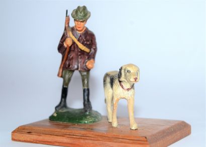DURSO DURSO: tourist souvenir "hunter and his dog" in composition on wooden base,...