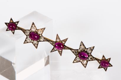 null 
MAGNIFICENT GOLD AND SILVER BARETTES forming five stars, adorned with five...