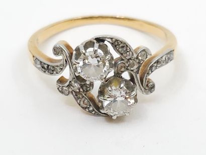 null RING you and me in two-tone 750° gold set with old-cut diamonds of about 0.20...