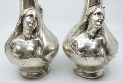 null H. SIBEUD. 
 Two pewter vases, mounted as lamps, with relief decoration of busts...