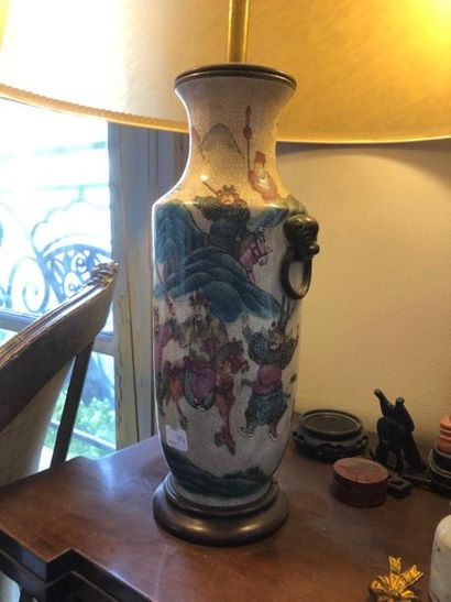 null NANKIN
Cracked porcelain baluster vase with warrior decoration, golden metal...