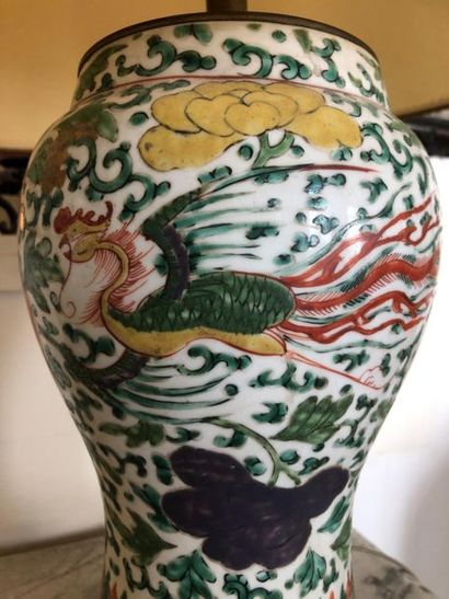 null CHINA. 
Porcelain baluster vase with enamelled decoration of peonies, foliage...
