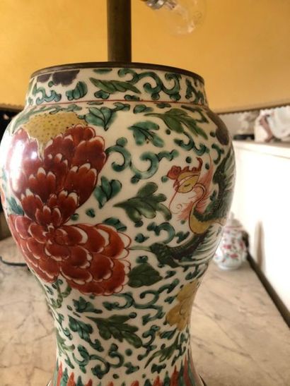 null CHINA. 
Porcelain baluster vase with enamelled decoration of peonies, foliage...