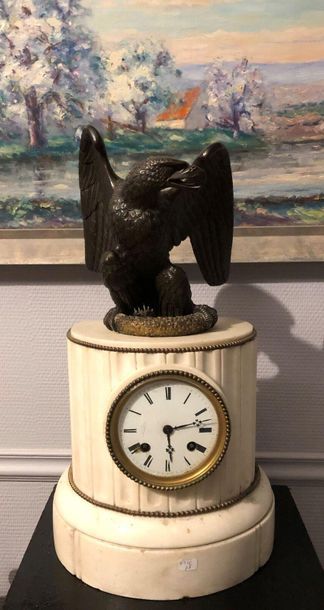 null Marble clock surmounted by a bronze eagle (1815). 
 Top. : 44 cm ; Width : about...