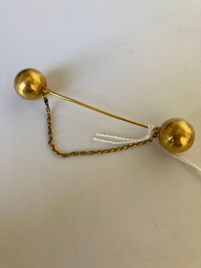 null Pin of jabot in yellow gold 750 thousandths, the ends in the shape of balls.

(Pin...
