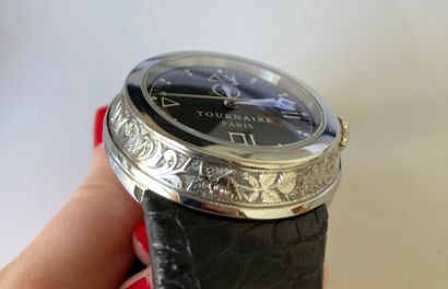 null TOURNAIRE 

Paris

Steel wristwatch. Case engraved with leafy motifs. Black...