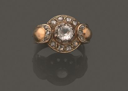 null Yellow gold ring 750 thousandth, the center decorated with a white imitation...