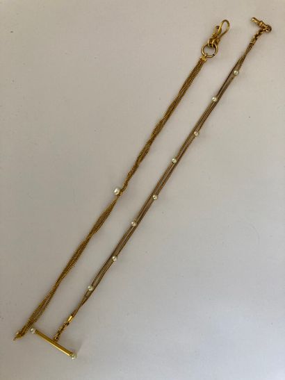 null Lot in yellow gold 750 thousandths including a vest chain two strands in braided...