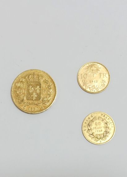 null Trois pièces dont : 



Une pièce de quarante Francs or Charles X 1830, 

une...