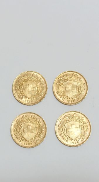 null Quatre pièces dont : 



Trois pièces de 20 Francs Suisse or 1935, 

une pièce...
