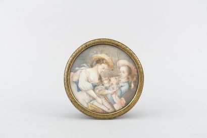 null Circular snuffbox decorated with a miniature on ivory showing two female musicians

Late...