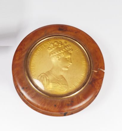 Circular wooden snuffbox, the lid decorated...