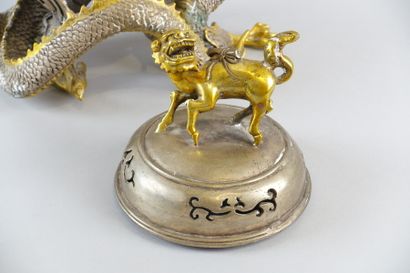 null A partially gilded pewter incense burner decorated with a dragon and a dog

Height...