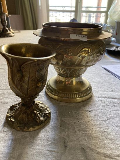 null A copper (?) goblet and cup on a pedestal with chased leaves and waves

Height...