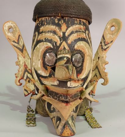 null Udok" mask representing a fantastic bird with a long beak and pointed teeth....