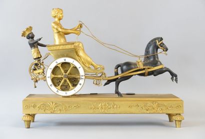 null A gilt bronze and patinated clock with a chariot representing an allegory of...