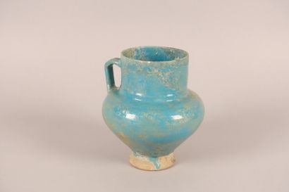 null Iran, 12th-13th centuries

A pitcher with a pear-shaped body, handle and high...