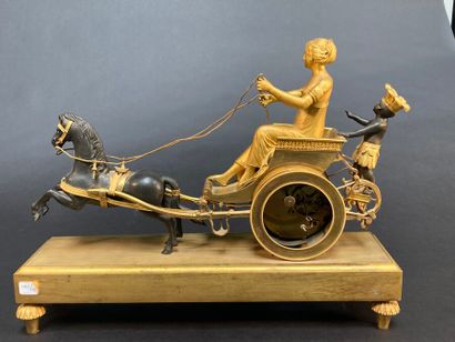 null A gilt bronze and patinated clock with a chariot representing an allegory of...