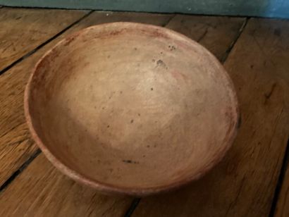 null Ceremonial bowl with glyph decoration

Brown terracotta with red, orange and...