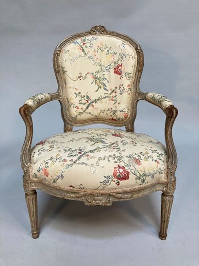 null A painted beechwood armchair with cabriolet back, decorated with hearts, cartouches...