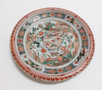 null CHINA

A circular dish with a gadrooned edge, decorated with polychrome enamels...