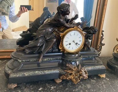 null Black marble, patinated and gilt bronze clock featuring a young woman and a...