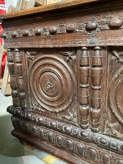 null Moulded and carved oak chest, the front with two compartments enclosing discs,...