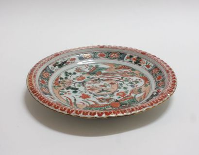 null CHINA

A circular dish with a gadrooned edge, decorated with polychrome enamels...