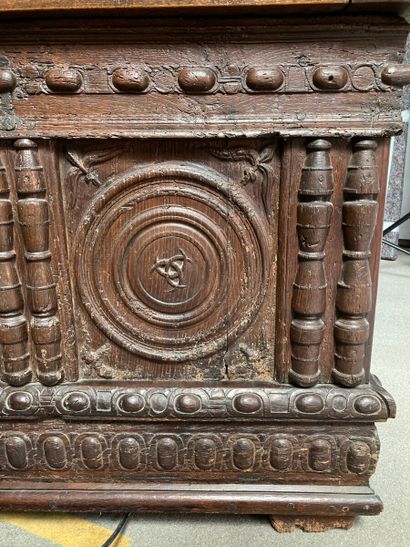 null Moulded and carved oak chest, the front with two compartments enclosing discs,...