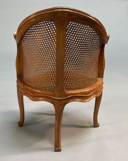 null Beechwood caned desk armchair, molded and carved, with foliage and flowers decoration,...