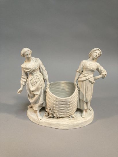 null Manufacture Karl ENS.

Cookie group with two women carrying a basket on a terrace...