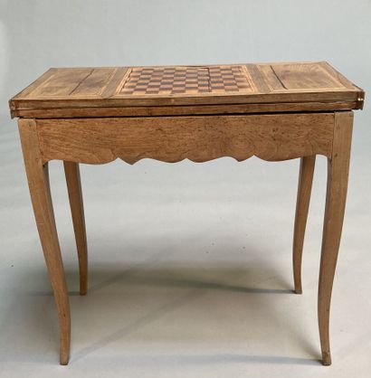 null Fruitwood game table with folding top and sliding base, resting on cambered...