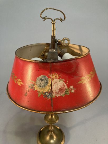 null Foot lamp style hot water bottle on a circular pedestal, the lampshade in red...