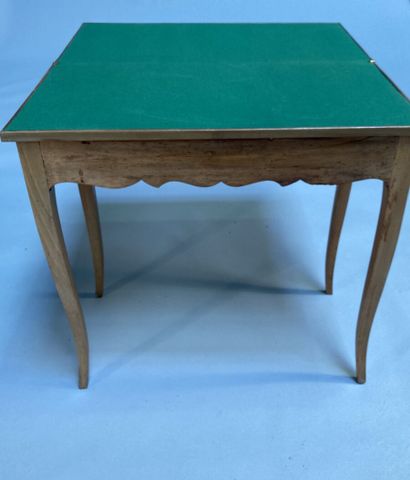null Fruitwood game table with folding top and sliding base, resting on cambered...