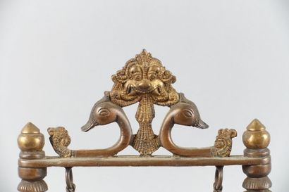 null INDIA

Patinated bronze group representing Ganesh on a mobile swing, between...