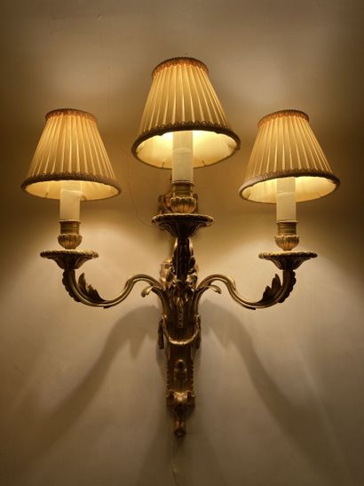 null Pair of ormolu sconces with three arms of light decorated with acanthus leaves...
