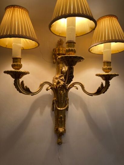 null Pair of ormolu sconces with three arms of light decorated with acanthus leaves...