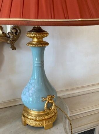 null Pair of celadon porcelain baluster-shaped lamp bases with floral motifs, the...