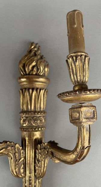 null Pair of carved and gilded wood sconces with two light arms, decorated with interlacing,...
