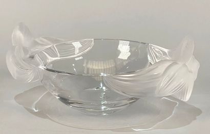 null LALIQUE Paris
Large pressed-molded glass bowl with flower design.
(Chipped at...