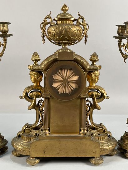 null Gilded metal mantel set including a clock and a pair of candelabras.
(Accidents,...