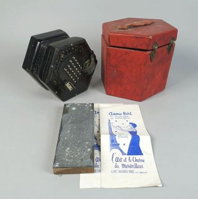 null A collection of objects including an accordion, an Annie Bert stamp pad and...