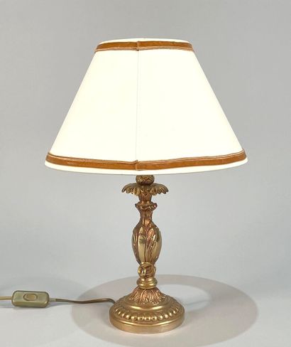 null Gilded metal lamp base decorated with foliage and gadroons
Work in the style...