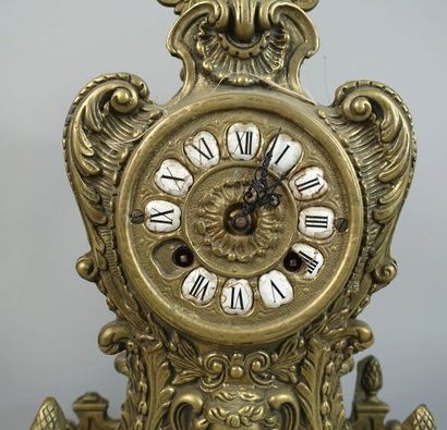 null Gilded metal mantel set including a clock and two candlesticks decorated with...