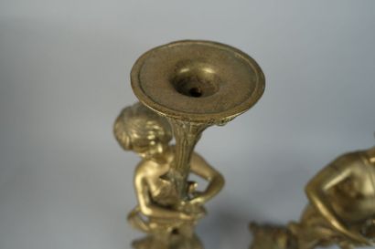 null Pair of gilded metal ceroferous angels, the base quadripod gadrooned.
(Worn.)
Height...
