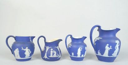 null WEDGWOOD
Meeting of four jugs decorated in the antique cameo style on a blue...